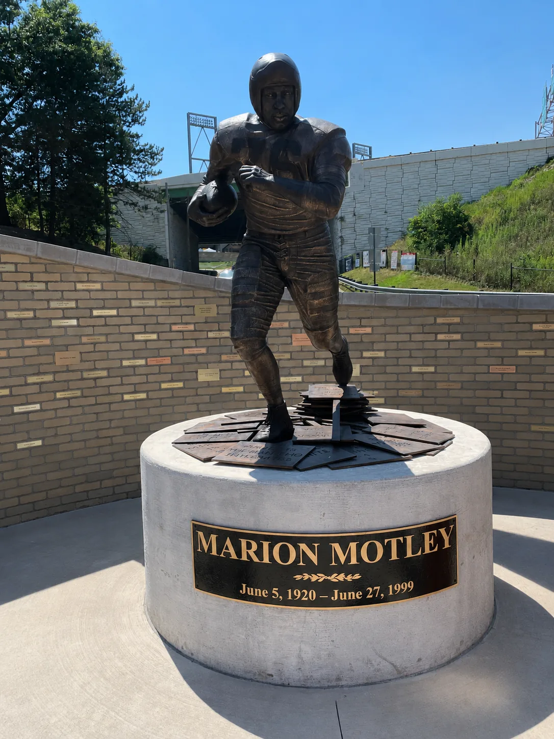 Bronze Marion Motley statue with commemorative cast plaque installed at its base