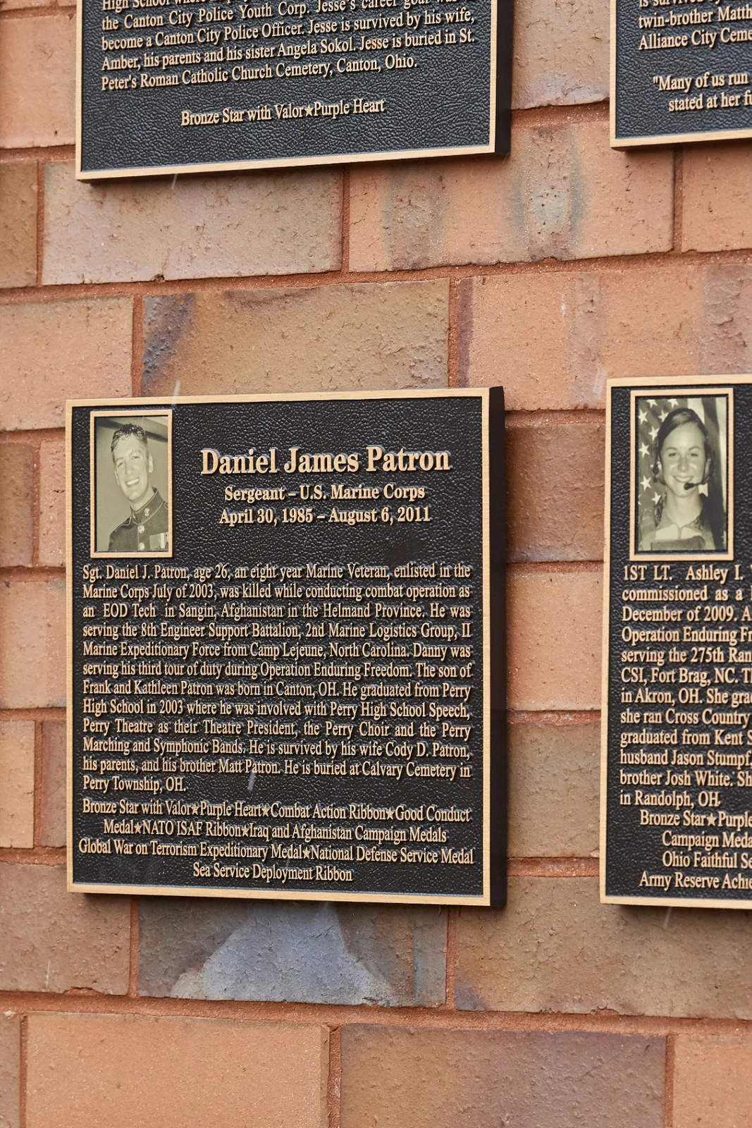 Cast bronze memorial plaque honoring a U.S. Marine Corps service member displayed on a community Wall of Honor